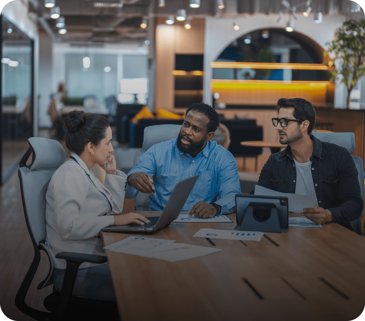 Office team discussing project at table