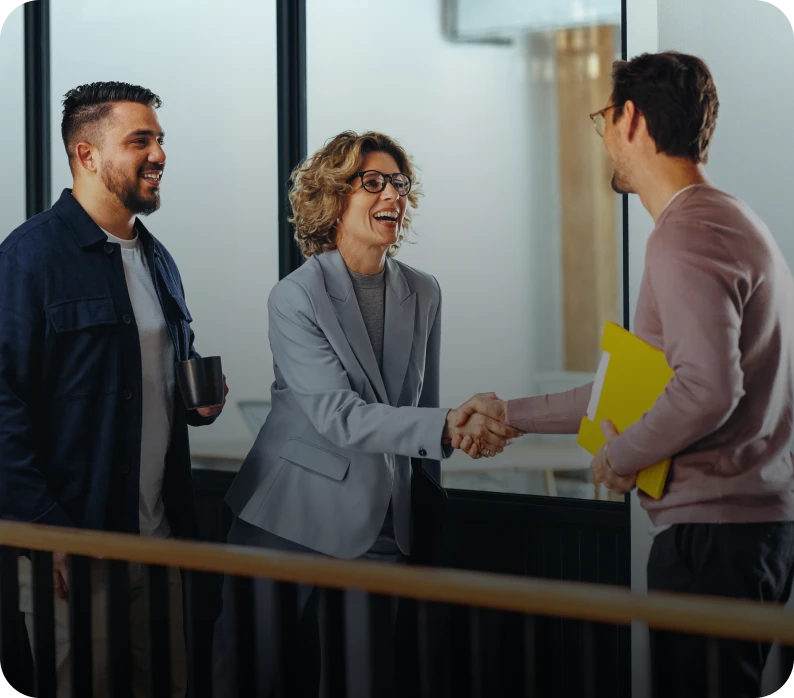 Colleagues greeting with handshake